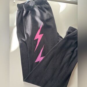 Aviator Nation Black Joggers with Pink to Purple Lightning Bolt Gradient